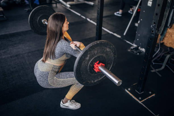 istock Young woman training in gym 1395414555