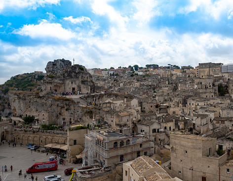 Matera, Basilicata, Italy. August 2021. Stunning view with the rock church of Santa Maria di Idris further up on the left. Urban landscape of stones.