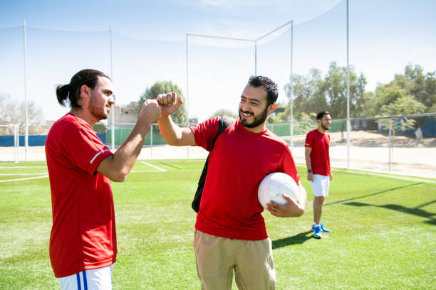 istock Soccer players greeting team mates 1395415687
