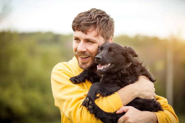 istock Young Man Having Fun With His Dog 1395415952