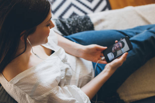 istock Young woman doing video chat with men at home. 1395417896
