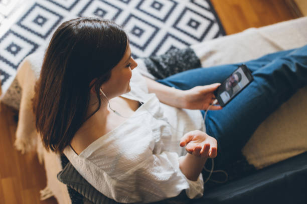 istock Young woman doing video chat with men at home. 1395417897