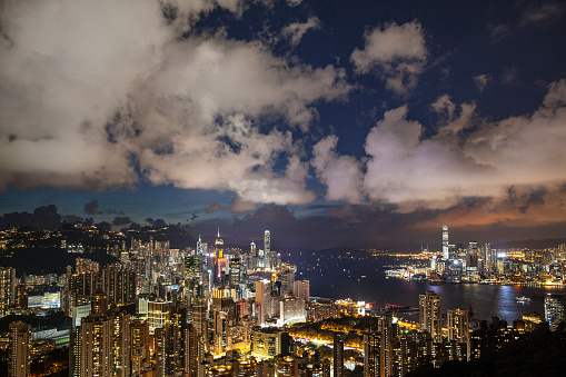 Sunset view of Hong Kong cityscape and Victoria Peak from Braemar Hill Peak