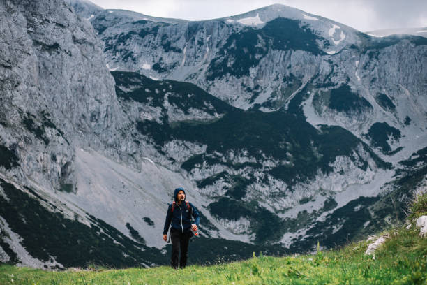 istock man in his late 40s hiking the mountain range 1395419150