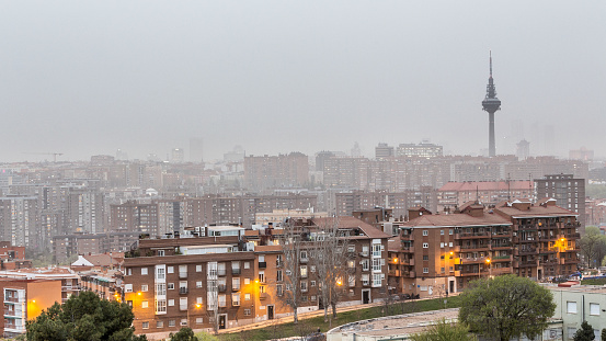 Ciudad de Madrid bajo nubes de neblina y contaminación del desierto saharaui photo