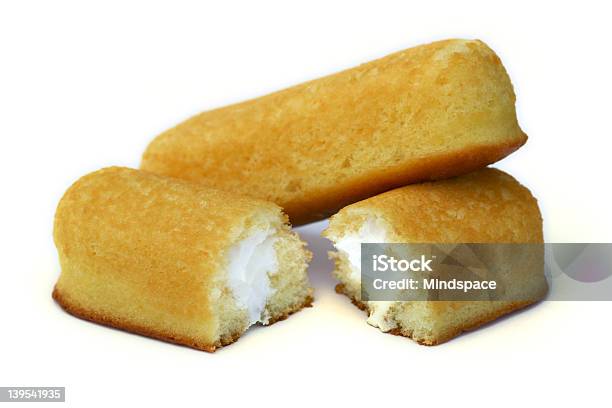 Two Icing Filled Yellow Cake Rolls Stock Photo - Download Image Now - Cake, Cut Out, Dessert - Sweet Food