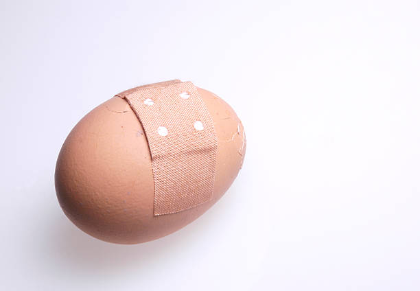 egg with bandaid stock photo