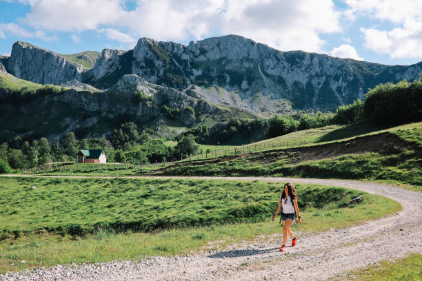 istock woman on the mountain hike 1395420852