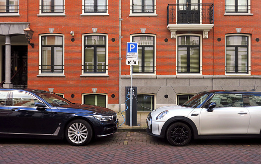 electric car charging station, able to charge two cars, on the street in a place reserved for charging cars, in the historic city center of Amsterdam