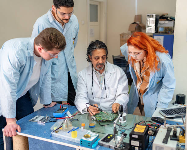 istock Group of young people in technical vocational training with teacher 1395428748