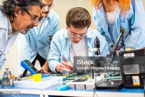istock Group of young people in technical vocational training with teacher 1395428816