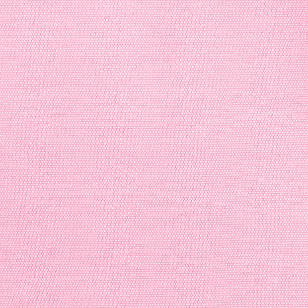 istock Woven cotton linen fabric textile textured backdrop in pastel light sweet romantic pink 1395432598
