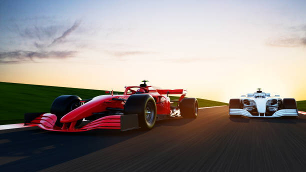 istock red race car leading on a race track 1395433767