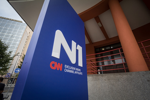 Picture of a sign with the logo of N1 in Ljubljana, Slovenia. N1 is a 24-hour cable news channel launched on 30 October 2014. The channel has headquarters in Ljubljana, Belgrade, Sarajevo and Zagreb and covers events happening in Central and Southeastern Europe. Available on cable TV throughout former Yugoslavia, N1 is CNN International's local broadcast partner and affiliate via an agreement with the London-based Turner Broadcasting System Europe. As it is focused on the audiences of the three countries in which it is headquartered, it has three separate editorial policies, separate reporters, TV studios as well as internet and mobile platforms. In cases where news overlaps, it is presented jointly.
