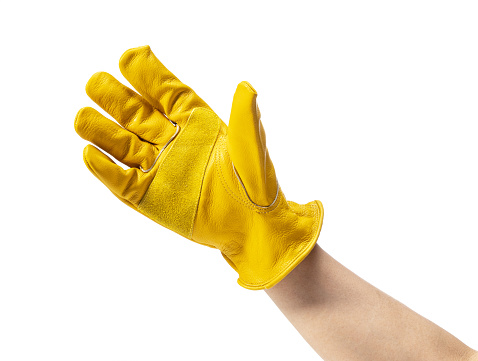 Male hand wearing yellow leather glove on white background. Sign with hand.