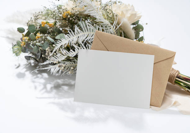 istock Dried flower bouquet and blank message card placed on white background. 1395439622