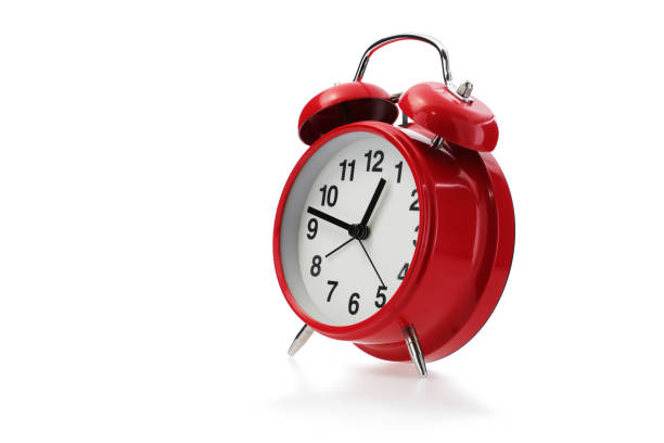 istock Red retro alarm clock in white with shadow 1395440575