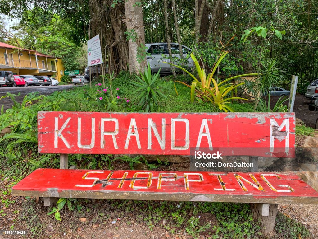 A red bench with KURANDA logo at street, Kuranda townscape in Queensland, Australia Kuranda townscape in Queensland, Australia. Ancient Stock Photo