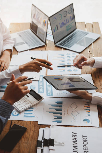 Accounting team, Accounting team, Cropped shot of diverse coworkers working together in the boardroom, brainstorming, discussing, and analyzing business strategy. b2b sales stock pictures, royalty-free photos & images