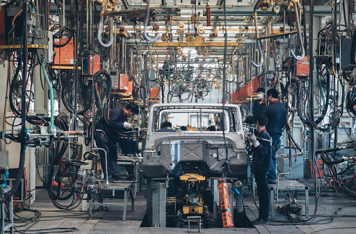 Workers in an automoble factory in Beijing,China.