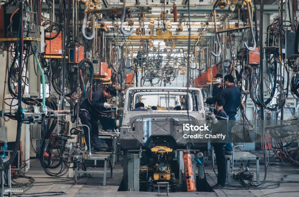 Automobile factory assemble line Workers in an automoble factory in Beijing,China. Factory Stock Photo