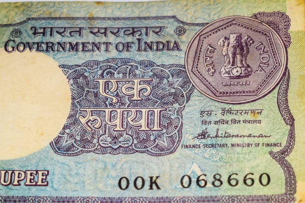 istock Old One Rupee notes combined on the table, India money on the rotating table. Old Indian Currency notes on a rotating table, Indian Currency on the table 1395450524