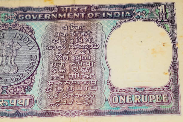 istock Old One Rupee notes combined on the table, India money on the rotating table. Old Indian Currency notes on a rotating table, Indian Currency on the table 1395450526
