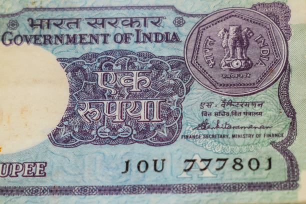 istock Old One Rupee notes combined on the table, India money on the rotating table. Old Indian Currency notes on a rotating table, Indian Currency on the table 1395450536