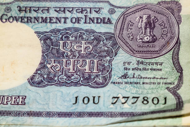 istock Old One Rupee notes combined on the table, India money on the rotating table. Old Indian Currency notes on a rotating table, Indian Currency on the table 1395450539