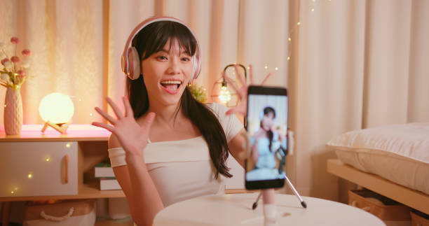 istock girl doing stream with phone 1395450564