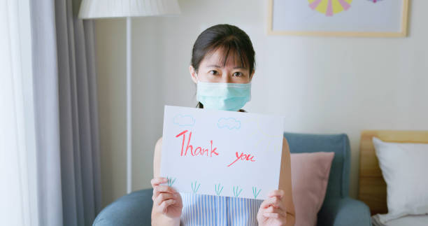 istock woman shows thank you billboard 1395450572