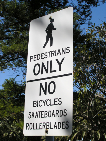 Pedestrians only sign. No skateboards!         