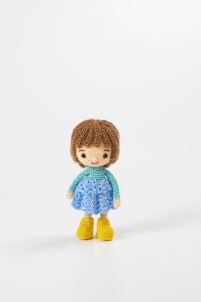 istock Small and cute Amigurumi doll on white background 1395451341