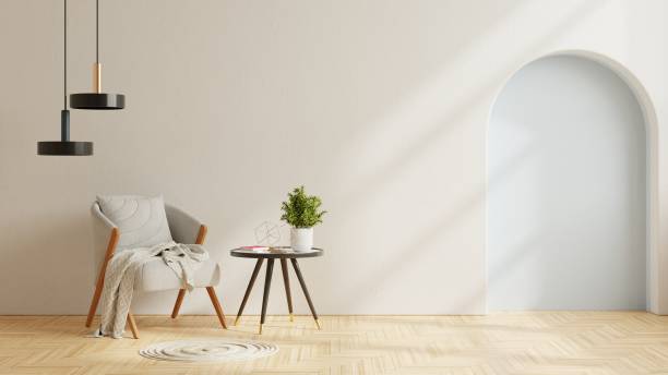 istock Modern minimalist interior with an armchair on empty plaster wall background. 1395451357