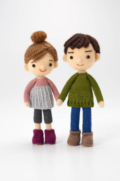istock Small and cute Amigurumi doll on white background 1395451384