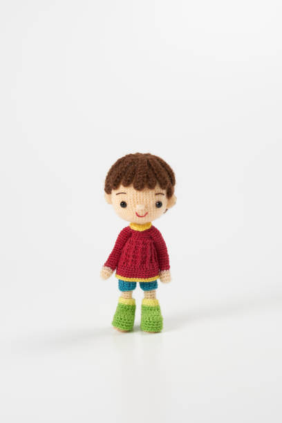 istock Small and cute Amigurumi doll on white background 1395451392