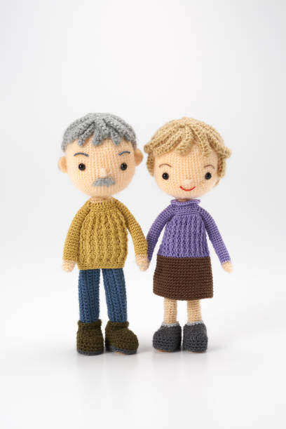 Small and cute Amigurumi doll on white background