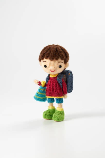 istock Small and cute Amigurumi doll on white background 1395451500
