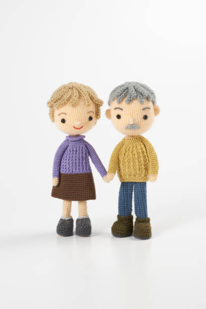 istock Small and cute Amigurumi doll on white background 1395451508