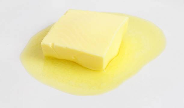 istock A slice of butter melting on a white background 139545534