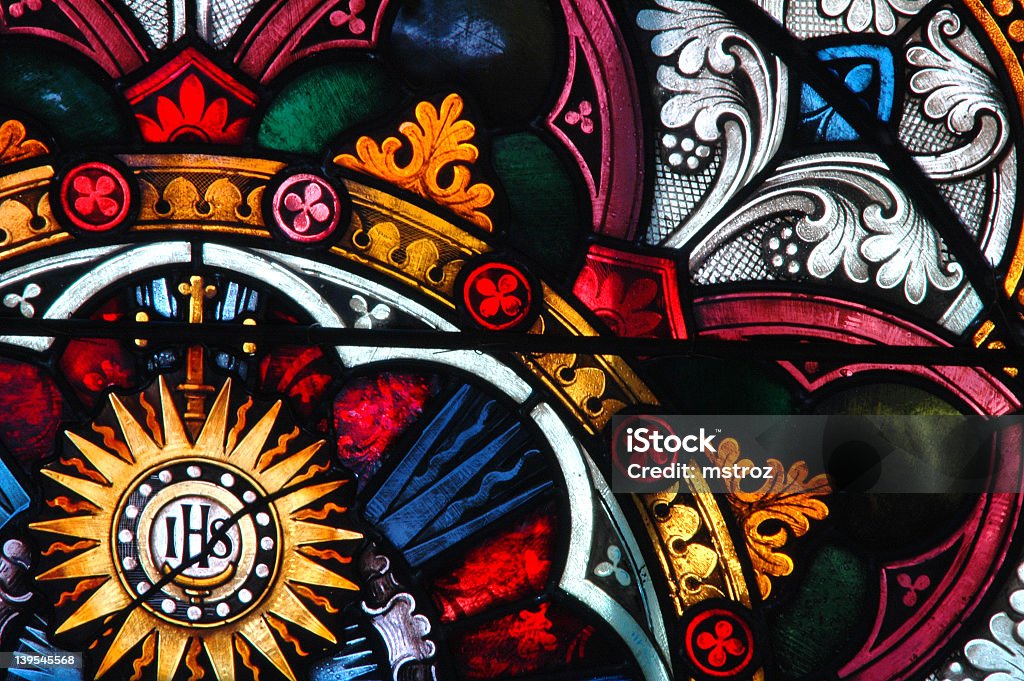 Colorful stained glass window pattern A close-up of a 150+ year old stained glass window. Stained Glass Stock Photo