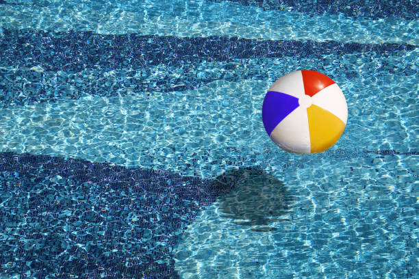 istock beach ball in the blue swimming pool 1395455693