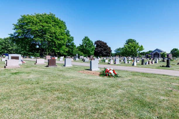 istock Cemetery Grave Site Filled After Funeral Service 1395456692