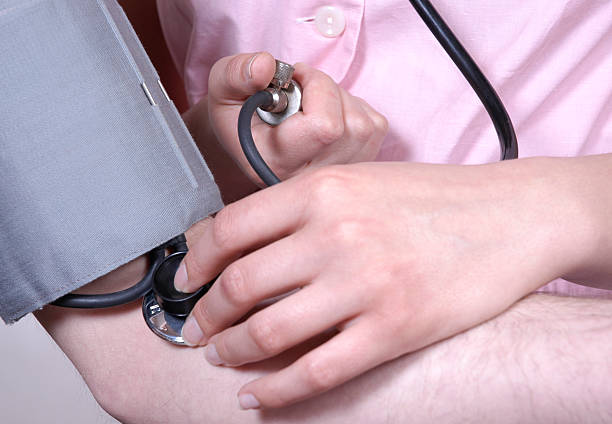 taking blood pressure 2 stock photo