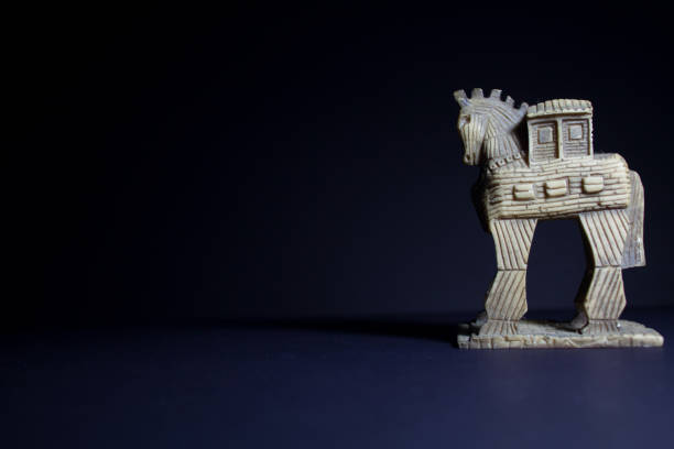 istock Miniature trojan statue on dark background 1395459326