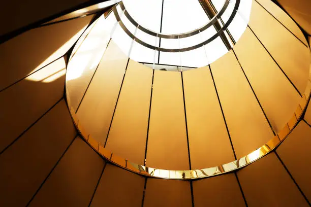 Photo of Modern architecture, metal architectural structure golden background
