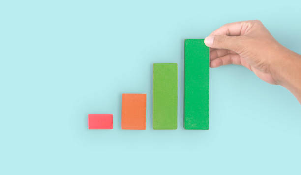 istock Business connecting piece of multi wood chart blocks steps in hand 1395460215