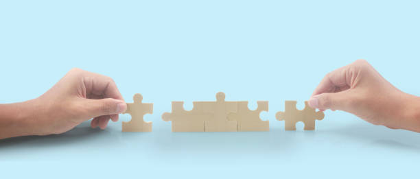 Connecting jigsaw puzzle. Business solutions success stock photo