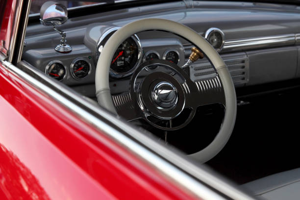 istock Classic retro beautiful red car. Close up steering wheel 1395460765