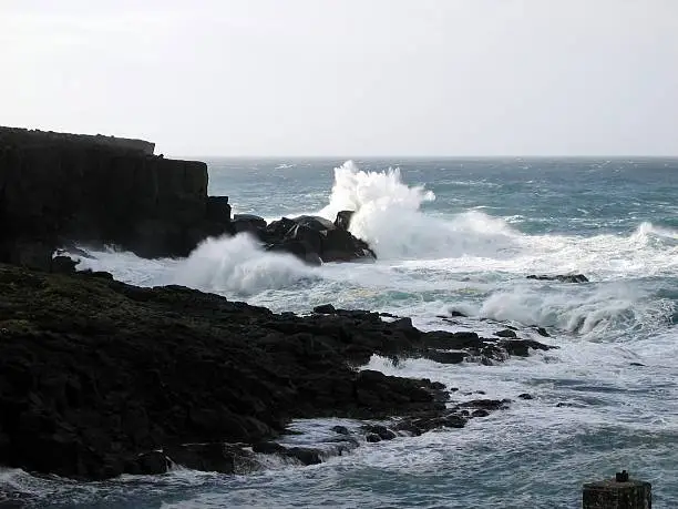 This winter day there waves made some great splashes when they did hit the rocks, west of Hvalba on the Faroe Islands.